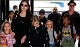  ??  ?? CUSTODY FIGHT: Jolie and Pitt with their children before their bitter split