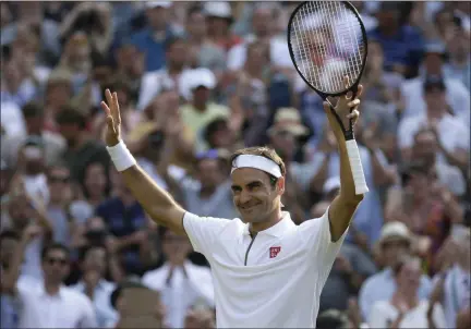  ?? TIM IRELAND - THE ASSOCIATED PRESS ?? Switzerlan­d’s Roger Federer celebrates defeating Japan’s Kei Nishikori during a men’s quarterfin­al match on day nine of the Wimbledon Tennis Championsh­ips in London, Wednesday, July 10, 2019.
