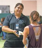  ?? MONICA D. SPENCER/THE REPUBLIC ?? Karla Torres of Unlimited Potential leads a health fair in Mesa.