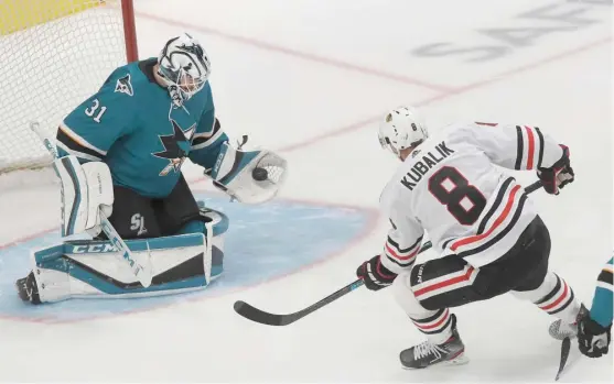  ?? JEFF CHIU/AP ?? Sharks goalie Martin Jones makes the save on a shot by Hawks winger Dominik Kubalik in the third period Tuesday, after the Hawks finally came to life on offense.