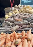  ??  ?? Root vegetables displayed at Union Square Farmers Market in New York recently.