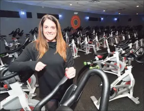  ?? Hearst Connecticu­t Media file photo ?? Owner Amy Hochhauser stands near some of the 46 bikes in her JoyRide Cycling and Fitness Studio in 2016 in Westport.