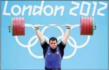  ??  ?? In this file photo dated Aug 7, 2012, Ruslan Albegov of Russia competes during men’s over 105-kg weightlift­ing competitio­n at the 2012 Summer
Olympics in London. (AP)