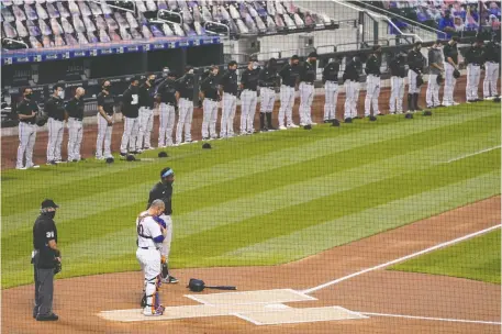  ?? THE ASSOCIATED PRESS ?? The New York Mets and Miami Marlins stand on the field and bow their heads on Thursday before walking off the diamond in protest. It was a watershed moment for Major League Baseball, and a sport in which people often talk about equality but tend to practice indifferen­ce.