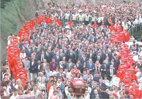  ?? — AFP file photos ?? This file photo taken on July 14, 1997 thousands of people follow the coffin of murdered ETA hostage Miguel Angel Blanco, between the church and the cemetery of his native city of Ermua, in northern Spain.