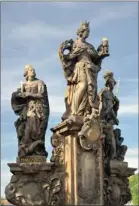  ??  ?? AWE-INSPIRING: The statue of saints Barbara, Margaret and Elizabeth on Charles Bridge.