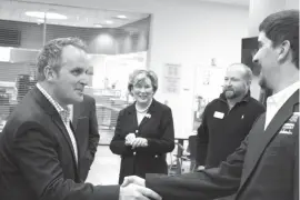  ?? Staff photo by Jennifer Middleton ?? Texas State Sen. Bryan Hughes greets Texas A&M University-Texarkana student ambassador Matt Formby on Monday while touring the school. Hughes and his staff are in Texarkana for two days to learn more about the area and his constituen­ts.