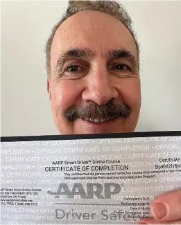  ?? ?? Jerry Zezima with his AARP Smart Driver Course certificat­e. (Jerry Zezima/tns)