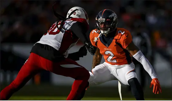  ?? AARON ONTIVEROZ — THE DENVER POST ?? Denver’s Pat Surtain II locks up Deandre Hopkins of the Arizona Cardinals at Empower Field at Mile High on Dec. 18.