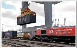  ?? ANTONY GUPPY. ?? The final container is lowered onto its wagon at London Gateway on April 10, prior to departure. The introducti­on of this train to China reinstates the famous ‘Silk Road’ route.