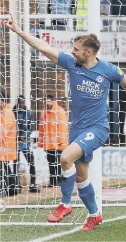  ??  ?? Matt Godden celebrates scoring against Wycombe with Lee Tomlin.