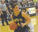  ?? TODD BAILEY/HOBBS NEWS-SUN ?? Santa Fe High senior Elena Gonzales handles the ball Friday as she is guarded by Hobbs’ Priscilla Orona. The Demonettes lost the Class 6A State Tournament game 73-27.