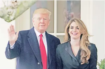  ?? — AFP photo ?? File photo shows Trump poses with former communicat­ions director Hope Hicks shortly before making his way to board Marine One on the South Lawn and departing from the White House.