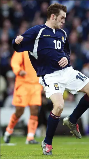  ?? ?? James McFadden faces up to Edgar Davids in 2003 as Scotland took on