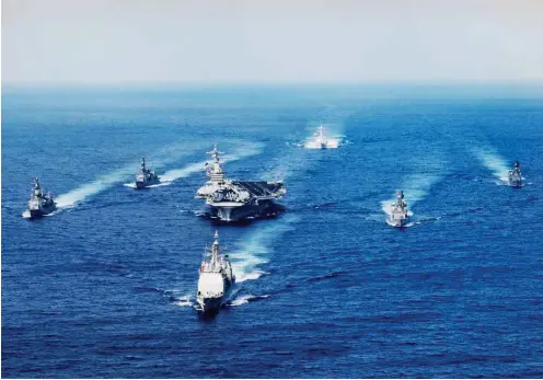  ?? Foto: dpa/US Navy ?? Erst im März absolviert­e der »Carl Vinson«-Trägerverb­and eine Anti-Nordkorea-Übung gemeinsam mit japanische­n Schiffen.