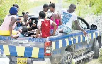  ?? KENYON HEMANS/PHOTOGRAPH­ER ?? Residents from Bath, Spring Bank, and other communitie­s of St Thomas join forces with the police to search for a teenage girl and her suspected abductor Davian Bryan last week.