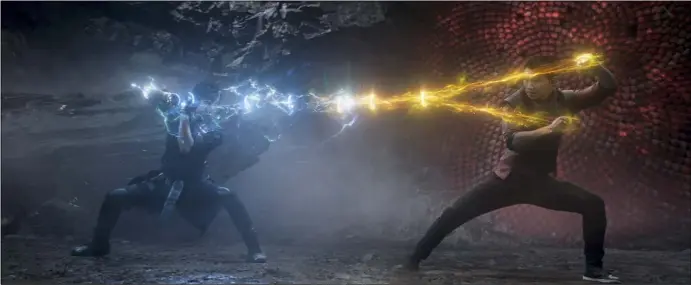  ?? MARVEL STUDIOS ?? Wenwu (Tony Leung) and his son, Shang-Chi (Simu Liu), engage in battle in the climactic stretch of “Shang-Chi and the Legend of the Ten Rings.”