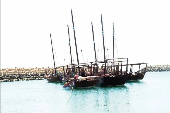  ??  ?? Some of the dhows ready for sail-hoisting.