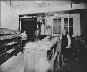  ?? Submitted photo ?? This photo dates from the 1920s or ’30s and shows Harry Firmin, right, in his print shop in the basement of the Hotel Grim in Texarkana, Texas. The family business would eventually become Firmin’s Office City, which is celebratin­g its 100th anniversar­y...