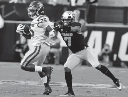  ??  ?? Nick Fisher tackles Southern Cal’s Ronald Jones II last season in a game at Folsom Field.