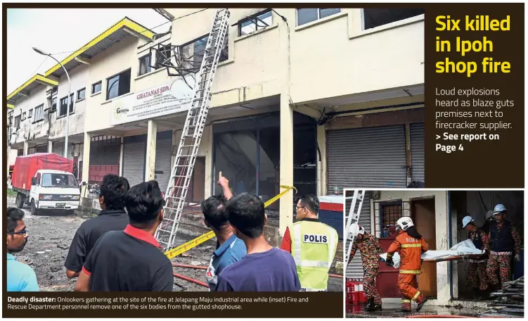  ??  ?? Deadly disaster: Onlookers gathering at the site of the fire at Jelapang Maju industrial area while (inset) Fire and Rescue Department personnel remove one of the six bodies from the gutted shophouse.