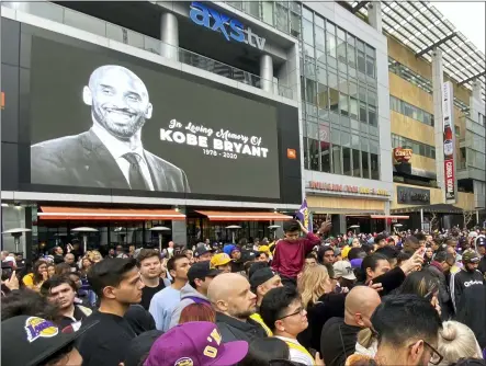  ?? KEITH BIRMINGHAM — ORANGE COUNTY REGISTER ?? Fans mourn the loss of Kobe Bryant in front of La Live across from Staples Center on Jan. 26in Los Angeles.