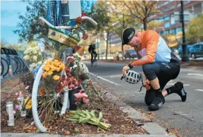  ?? AP PHOTO ?? Cyclist Eric Fleming, 41, stops to express his condolence­s in front of a bike memorial, set up to remember the victims of Tuesday’s attack in New York.