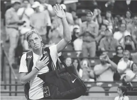  ?? PHOTOS: NATHAN DENETTE/THE CANADIAN PRESS ?? Denis Shapovalov waves to the crowd after the Canadian was defeated in quick fashion 7-5, 6-2 by Robin Haase of the Netherland­s on Thursday night in the third round of the Rogers Cup at the Aviva Centre in Toronto.
