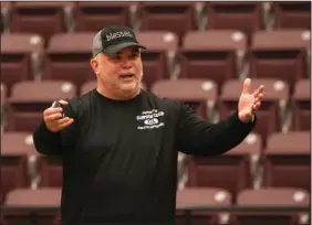  ?? The Sentinel-Record/Richard Rasmussen ?? GET MOTIVATED: Darin Beckwith, director of Dawson Education Services Cooperativ­e, talks to a group of educators from six of the seven Garland County school districts during the Countywide Profession­al Developmen­t event at Lake Hamilton’s Wolf Arena Thursday.