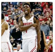  ?? JAY LAPRETE / ASSOCIATED PRESS ?? Ohio State’s Jae’Sean Tate celebrates scoring against Nebraska during the second half Monday in Columbus. Tate had 17 points and seven rebounds in the Buckeyes’ 64-59 win.