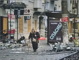  ?? ?? THE FEW civilians who remain in Bakhmut rarely see daylight because they spend most of their time in basements sheltering from the intense fighting.