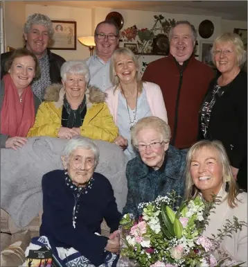  ??  ?? May McKelvie making a special presentati­on to Nancy Wall, on behalf of the former staff at the Murphy Floods Hotel Staff Reunion.