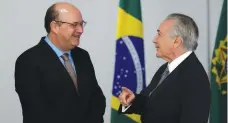  ?? (Ueslei Marcelino/Reuters) ?? ILAN GOLDFAJN, president-designate of the central bank, speaks with Brazil’s interim President Michel Temer at the Planalto Palace in Brasilia on May 17.