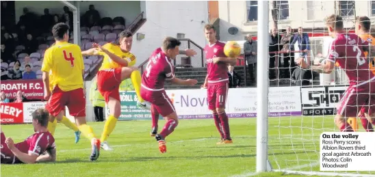  ??  ?? On the volley Ross Perry scores Albion Rovers third goal against Arbroath Photos: Colin Woodward