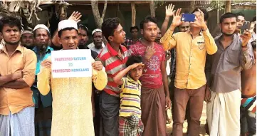  ??  ?? Rohingya refugees line the streets as United Nations Security Council convoy passes by, outside Kutupalong Refugee Camp in Cox’s Bazar, Bangladesh in this file photo. — Reuters photo