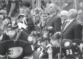  ?? Robert Gauthier
Los Angeles Times ?? BRUCE BOUDREAU, right, and his coaching staff watch the clock count down on the Ducks’ season in Game 7 ofWestern Conference finals against Blackhawks.