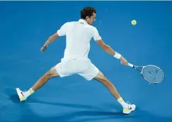  ?? AP Photo/Hamish Blair ?? ■ Russia’s Daniil Medvedev hits a backhand return to Greece’s Stefanos Tsitsipas during their semifinal match at the Australian Open tennis championsh­ip Friday in Melbourne.