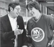  ??  ?? Islanders coach Al Arbour, left, talks with his top scorer, Mike Bossy, during a break in practice March 17, 1982, in Denver.