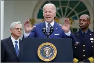  ?? (AP/Susan Walsh) ?? President Joe Biden speaks Friday in the Rose Garden of the White House in Washington during an event to highlight state and local leaders who are investing in American Rescue Plan funding. Attorney General Merrick Garland (left) and Kansas City, Mo., Police Department Police Chief Joe Mabin listen.