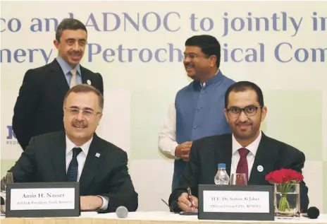  ??  ?? Minister of State and Adnoc chief executive Dr Sultan Al Jaber and Aramco chief executive Amin Nasser sign an agreement in New Delhi yesterday. The ceremony was attended by Minister of Foreign Affairs and Internatio­nal Co-operation Sheikh Abdullah bin...