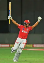  ??  ?? Mayank Agarwal of Kings XI Punjab celebrates after hitting the winning run in the second Super Over against Mumbai Indians on Sunday