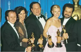  ??  ?? Weinstein celebrates Oscar wins for Shakespear­e in Love, alongside Gwyneth Paltrow, 1999