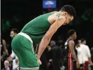  ?? CHARLES KRUPA/AP ?? Celtics forward Jayson Tatum rolled his left ankle on Boston’s first possession Monday.