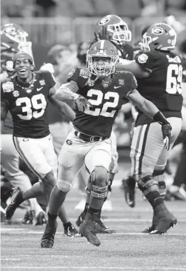  ?? MIKE ZARRILLI GETTY IMAGES ?? Georgia running back Kendall Milton celebrates after the go-ahead field goal during a Peach Bowl victory over undefeated Cincinnati.