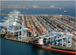  ??  ?? PORTS OF LOS ANGELES AND LONG BEACH – Ships gather off the ports of Los Angeles and Long Beach, California February 6, 2015 in this aerial image. The chief labor negotiator for shippers and terminal operators at 29 US West Coast ports raised the ante...