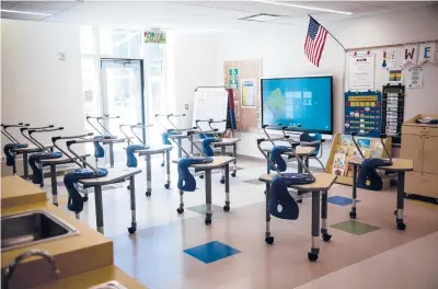  ?? KASSI JACKSON/HARTFORD COURANT ?? Most Connecticu­t school districts are following guidelines provided by the state Department of Education, which state that if a school sees two or more cases of the coronaviru­s within 14 days, local officials may close the school for two weeks.