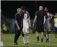  ?? ASSOCIATED PRESS FILE ?? Christian Pulisic is comforted after the United States lost, 2-1, at Trinidad and Tobago during a World Cup qualifier Oct. 10.