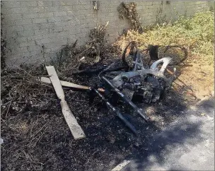  ??  ?? A burnt-out bike near Peachey Lane in Uxbridge