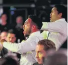  ?? PHOTO: GETTY IMAGES ?? Time to celebrate . . . Issac Luke and Jazz Tevaga, of the Warriors, perform a haka for teammate Roger TuivasaShe­ck after he received the Dally M Award.