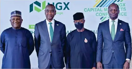  ?? ?? L–R: Abdul Samad Rabiu, executive chairman, BUA Group; A.B. Mahmoud, chairman, Nigerian Exchange Limited (NGX); Vice President Yemi Osinbajo of Nigeria; and Temi Popoola, CEO, Nigerian Exchange Limited (NGX), at the NGX inaugural Capital Markets Conference in Abuja, recently